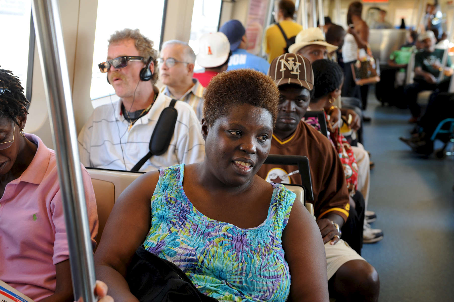 Decatur GA -- Lois Curtis rides MARTA rapid transit train with friends from Peer Center to book fair on the town square. 