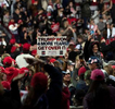 Thousands of Trump supporters converged on small town for Georgia Victory Rally to show support for President Donald Trump and two Republican incumbent U.S. senators Kelly Loeffler and David Perdue, who face democratic challengers in special run run-off election January 5, 2021. The election could decide control of the U.S. Senate.Pictured: Crowd erupts in cheers at end of rally, holding on to hope of a second term for President Trump despite election results