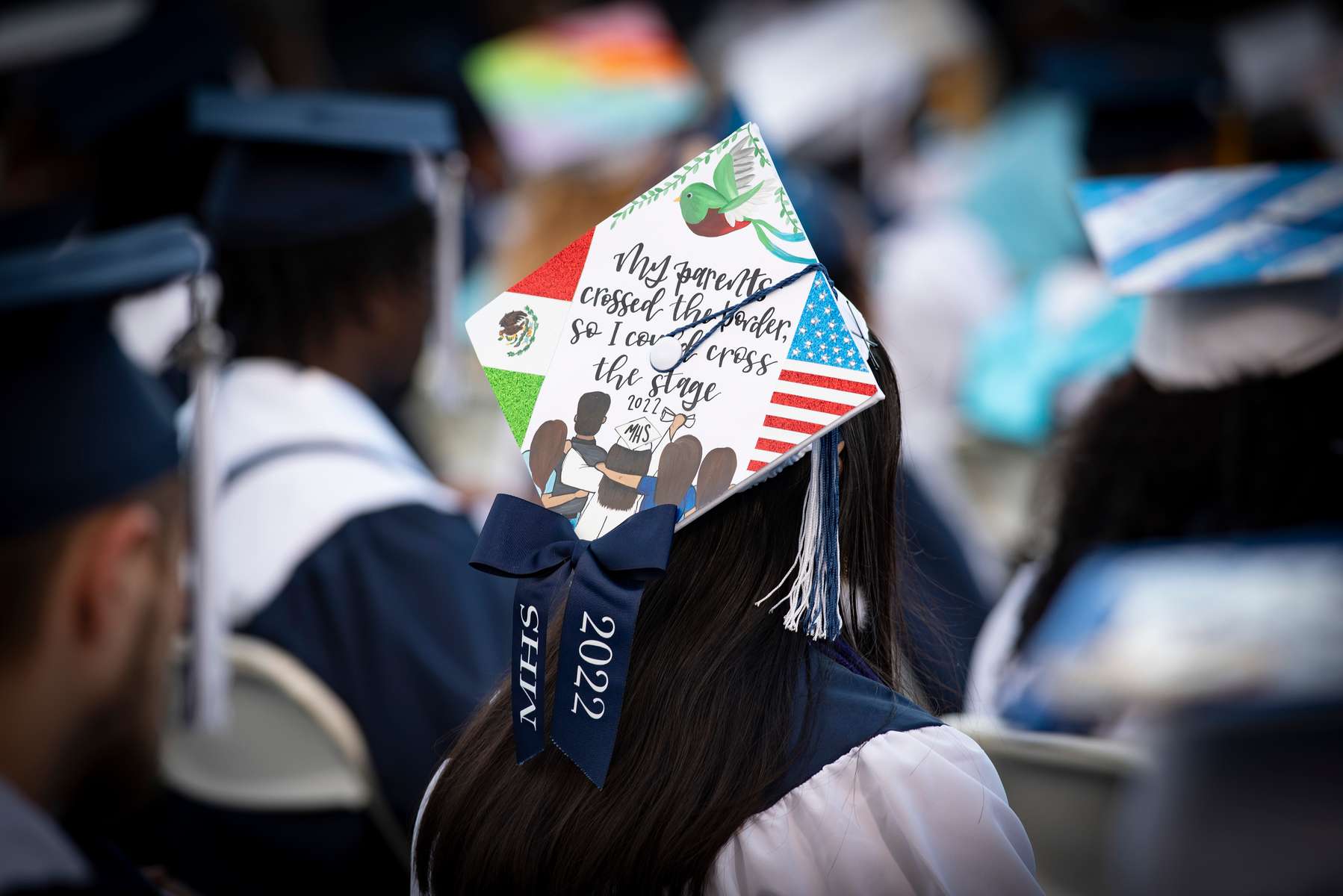 A Marietta High School graduate's cap tells the story of her family’’s journey, crossing the southern border years ago for a better life in the U.S.