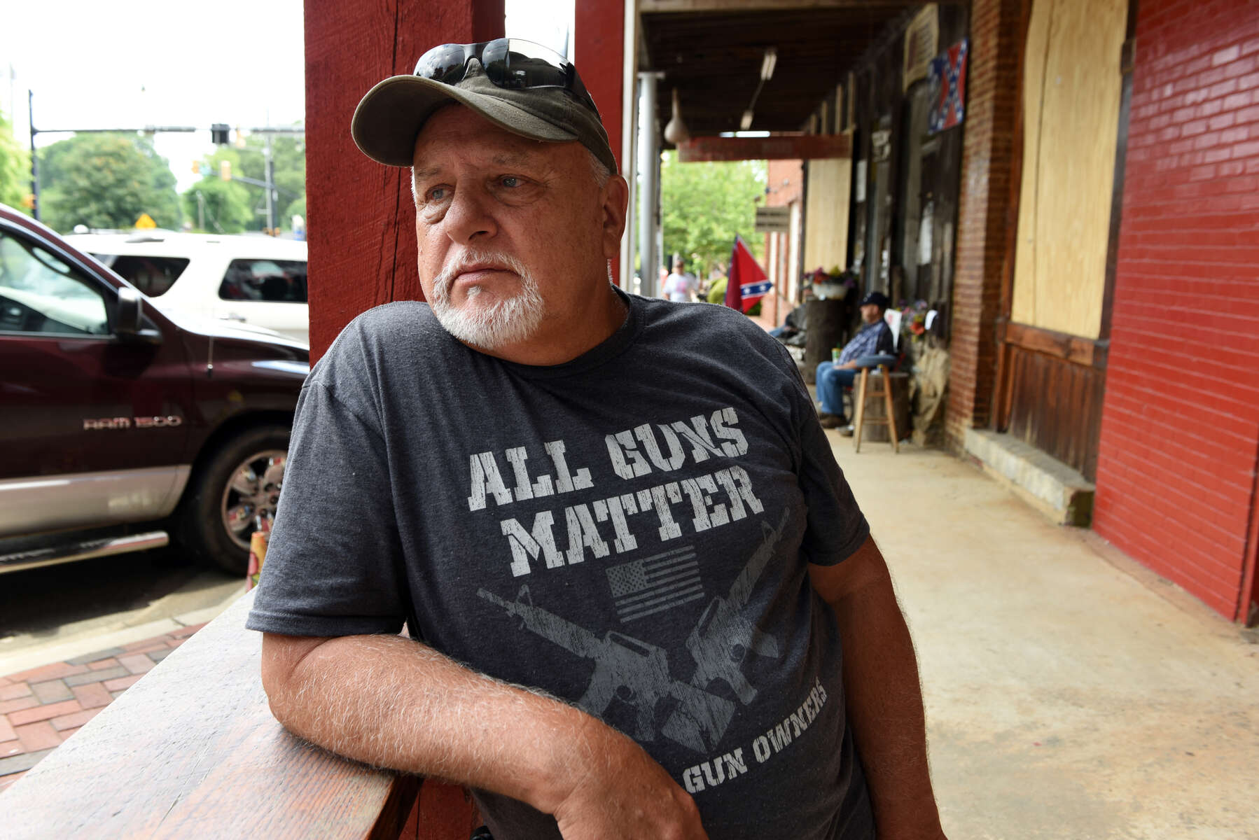 Bill Williams, 64, of Acworth, Ga, is a regular visitor and customer to Dent Myers’ Civil War Surplus shop. Williams is a strong advocate for open carry firearms laws. He was on the watch for protesters who were expected later in the day.