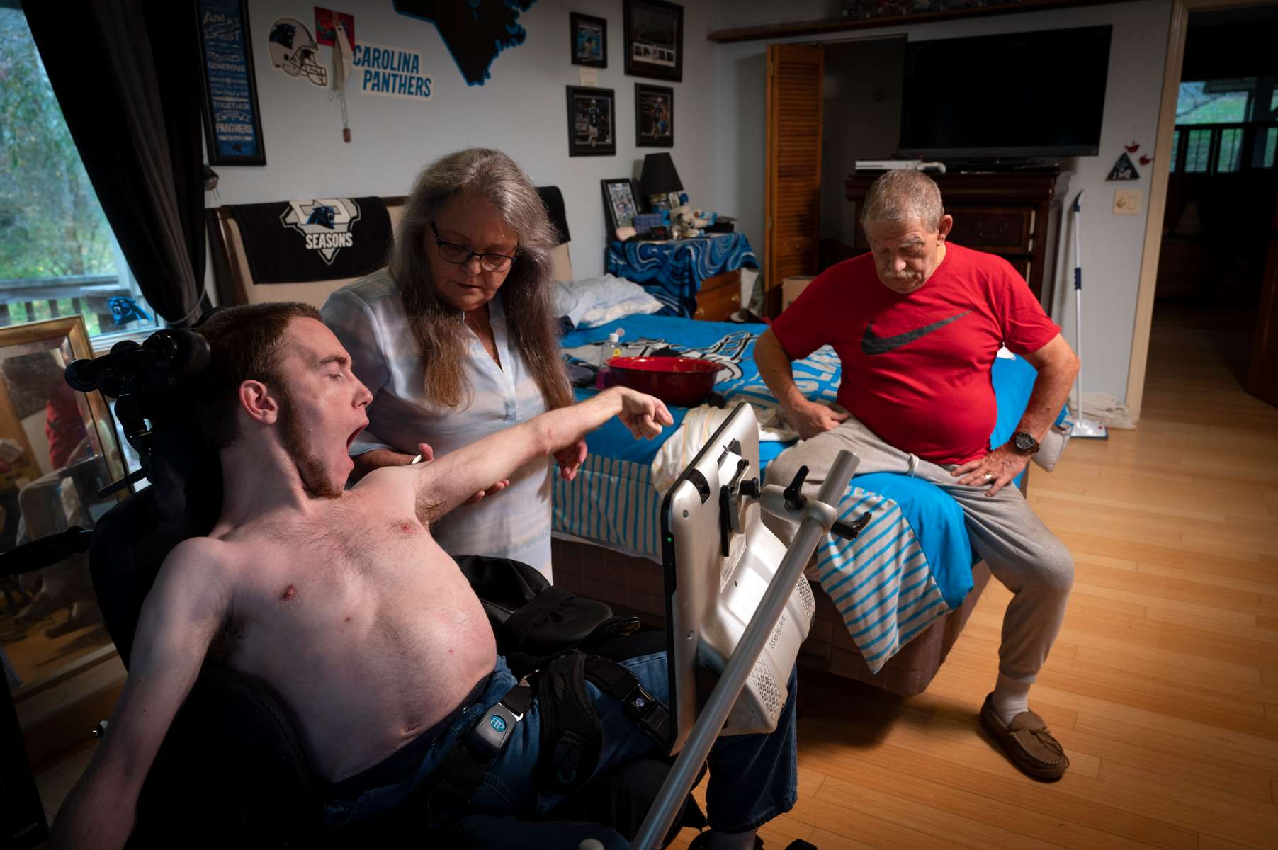 Luke Wilcox has his morning physical therapy session with his mother Nita. Luke has cerebral palsy and is non-verbal, and is unable to care for himself. He is a high school graduate, but must live with his aging parents because of a critical state-wide lack of in-home caregivers in North Carolina.