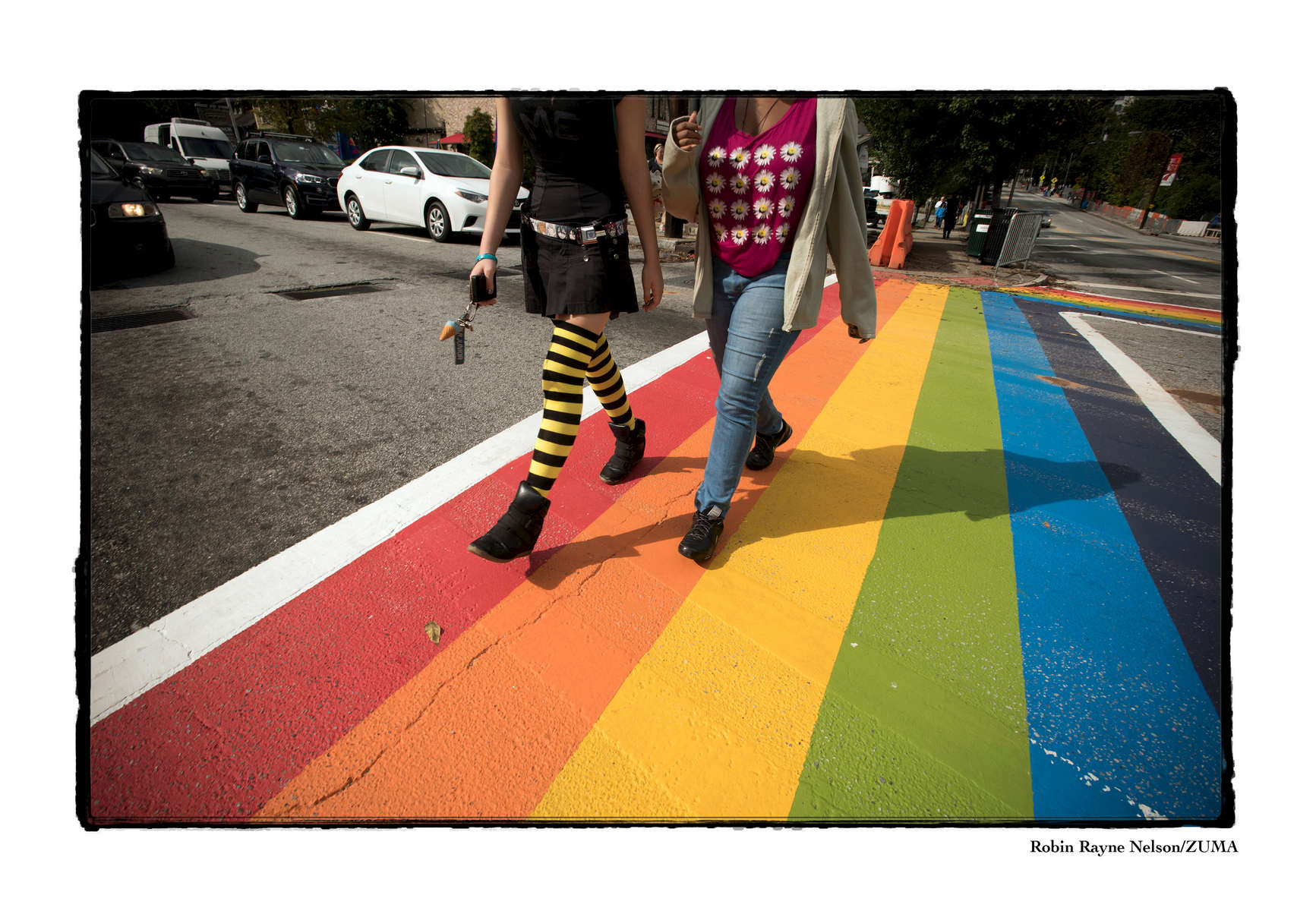 LGBT community celebrates Gay Pride in the city's midtown neighborhood, drawing thousands from across the South. Pictured: crosswalks at 10th and Piedmont Avenue are painted with Gay Pride colors for the weekend.