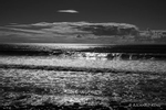 Black and White Photograph of Sun reflecting off North Sea wavs