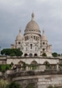 Colour photograph of the Sacre Coeur showing the elevations and he paths climbing up to the basillica