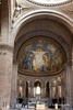 Colour photograph taken inside the Sacre Coeur Bassillica depicting the Alter and the ceiling mosaic of Christ welcoming you