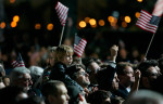 In the ticketed area, flags were waived as the crowd stared up at the projection screens, awaiting news that Senator Obama had won the election.
