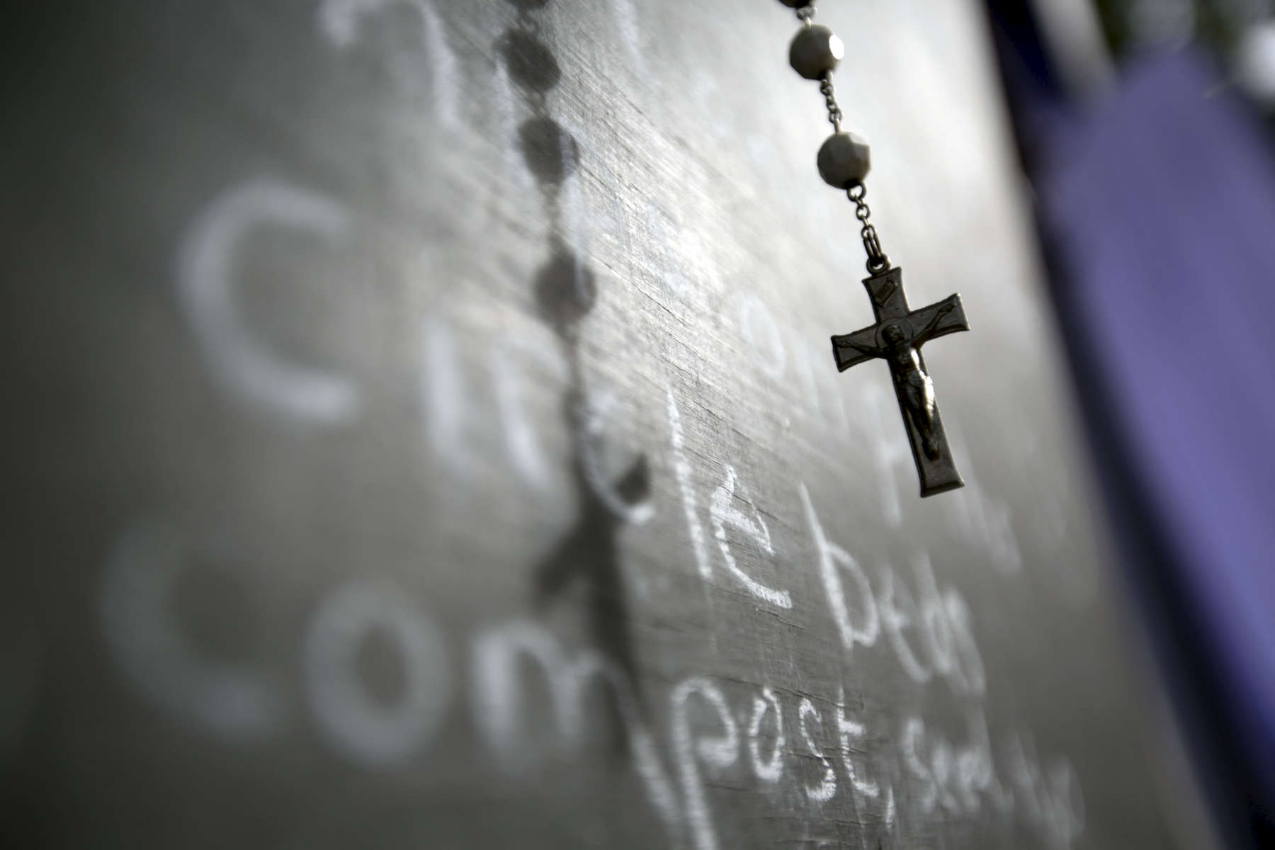 A rosary hangs on a message board in the Greeley Forest Garden in Portland, September 16, 2015. Organizers at the nonprofit Greeley Forest Garden want to partner with other area nonprofits to bring services to the camp, which is on an adjacent lot. Kristyna Wentz-Graff / Staffreligion Catholic