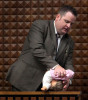 In a horrifying display, Milwaukee Det. James Hutchinson uses a doll to demonstrate how foster mother Crystal Keith admitted she positioned and held her 13-month-old foster son, as Hutchinson testifies in Keith's trial. Hutchinson stated this was the worst case of child abuse he had ever seen.