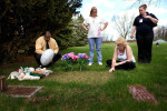 Following the conclusion of Crystal Keith's trial, a group of citizens arrived at Christopher Thomas's tiny grave. The grave is unmarked, save for a pile of stuffed animals and a thin layer of newly-seeded grass.