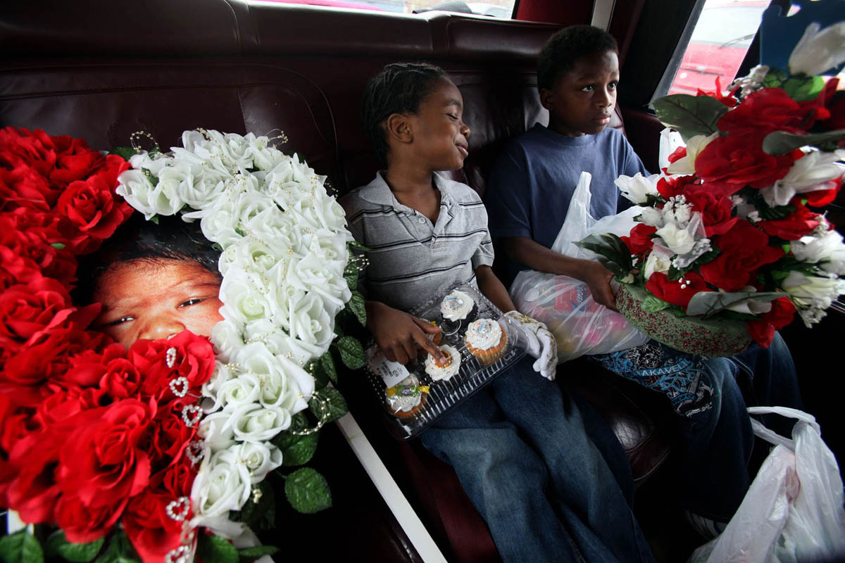 Evans has custody of his two other children, T-Mor Hendrix, 5, (left) and his brother Deshawn Evans, 10. They only know their baby brother through a handful of memories but continue to try and include him in their lives. They have a large photo that they take with them when they visit his grave at the cemetery. On this day, they take cupcakes, flowers and balloons to the grave site to celebrate baby Will's birthday.