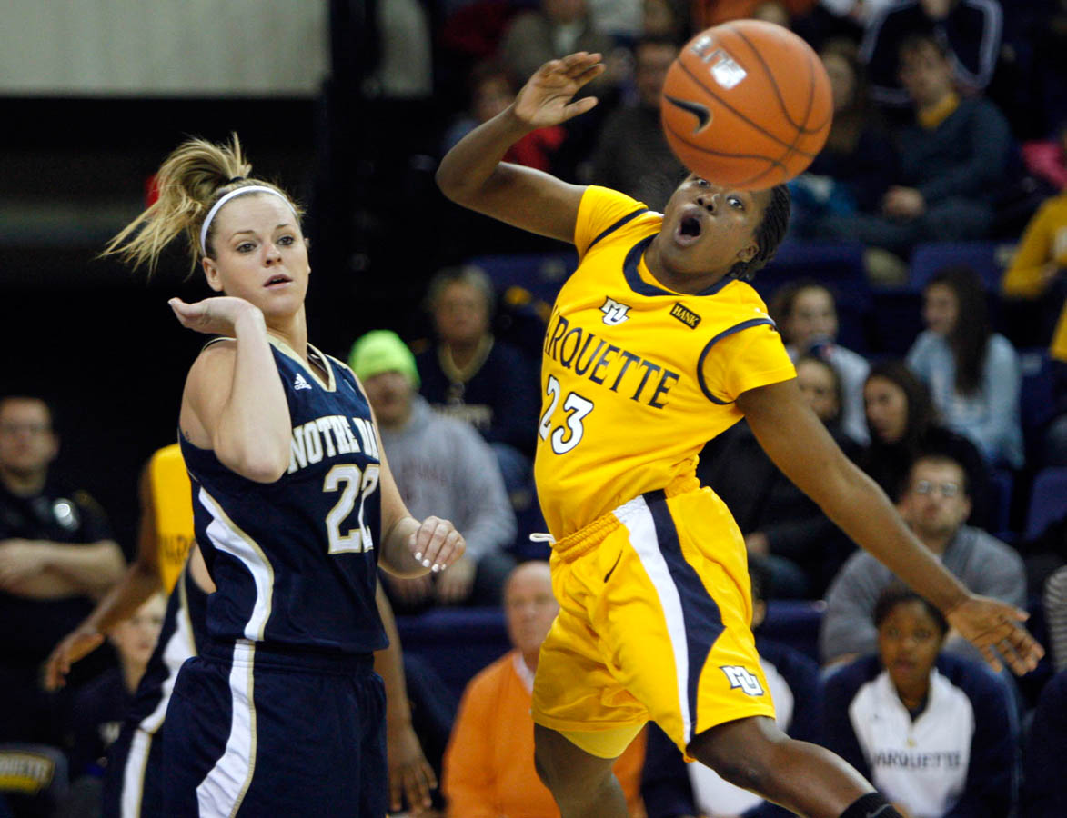 Marquette's Tatiyiana McMorris (right) watches the ball fly away after Notre Dame's Brittany Mallory knocked it out of her controlin the second half of Wednesday night's game at the Al McGuire Center in Milwaukee, January 5, 2011. Notre Dame won 73-55. 