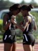 Riverside High School students Mariah Robinson-Page, 15 (left) and Demetra Camble, 15, hold hands as they say a prayer before running the 4x2 relay at the City Conference meet.