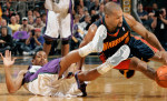 Milwaukee Bucks' Charlie Bell, left, and Golden State's Derek Fisher, right, collide as they chase down a ball.
