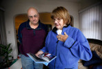 Robert J. Logan, left, and his wife Darlene M. Logan look at photos of Christopher Thomas, the happy boy they fostered for nearly three months. {quote}We need him to be remembered for what he was...such a good boy{quote} says Robert. {quote}Something like that shouldn't happen to kids.{quote} The couple says they asked repeatedly to be allowed to adopt Christopher, but were denied. He was placed in another foster care home after their attempts failed--the very home where he was beaten to death.