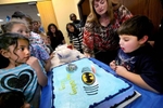 Izzy blows out his birthday candle during his Batman themed birthday party. He has just turned five and will soon be stepping out of the relative safe bubble in terms of dealing with gender. 