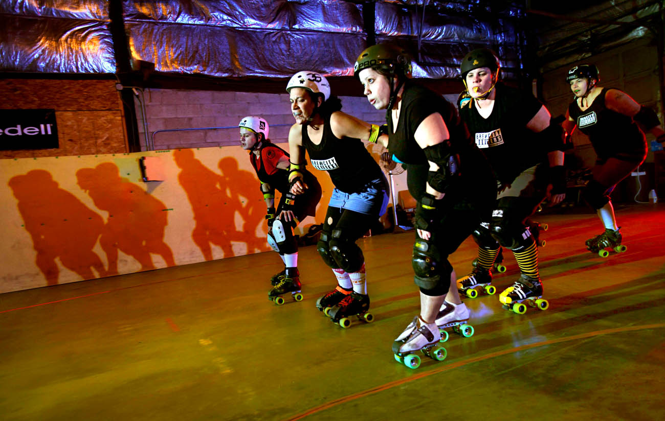 The Crazy Eights cruise their practice track during warm-ups. The team is part of the Brewcity Bruisers Milwaukee Rollergirls, a group that has brought the fun of rollerderby back to the area.