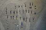 An aerial view of members of the {quote}Life Outside The Box {quote} Fitness Club during a training session led by instructor Alexa Hoovis at the beach on August 18, 2020 in Long Beach, New York.  Gyms, which have been closed in New York since mid-March to help prevent the spread of the coronavirus, will be allowed to open again as soon as August 24th Governor Andrew Cuomo has announced.  Gyms will be limited to a third of their capacity, and they need to maintain a sign-in sheet to help contact tracers in case of a virus outbreak. Air filters must be able to help prevent the transmission of viral particles. People must wear masks at all times. 