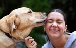 United States Paralympian Anastasia Pagonis plays with her guide dog named Radar at her home on June 2, 2024 in Garden City, New York.  Pagonis has autoimmune retinopathy which led her sight to decrease at the age of 11, and she lost her vision by the age of 14.  She competed in the swimming competition at the Tokyo 2020 Paralympic Games where she won a gold and bronze medal respectively in the 400m Freestyle S11 and 200-meter Individual Medley S11.  An S11 athlete is the most severe form of visual impairment. S11 swimmers all swim with blacked-out goggles to ensure a level playing field, blocking out all light so it's like swimming with a blindfold.  This is why they typically swim on the lane line and have tappers to inform them when they need to turn or stop.  She will be competing in the 400m Freestyle S11 at the 2024 Paralympic Games this summer in Paris, France. 