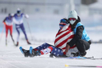 ZHANGJIAKOU, CHINA - FEBRUARY 20: Jessie Diggins of Team United States reacts with a member of Team United States after winning silver during the Women's Cross-Country Skiing 30k Mass Start Free on Day 16 of the Beijing 2022 Winter Olympics at The National Cross-Country Skiing Centre on February 20, 2022 in Zhangjiakou, China. 
