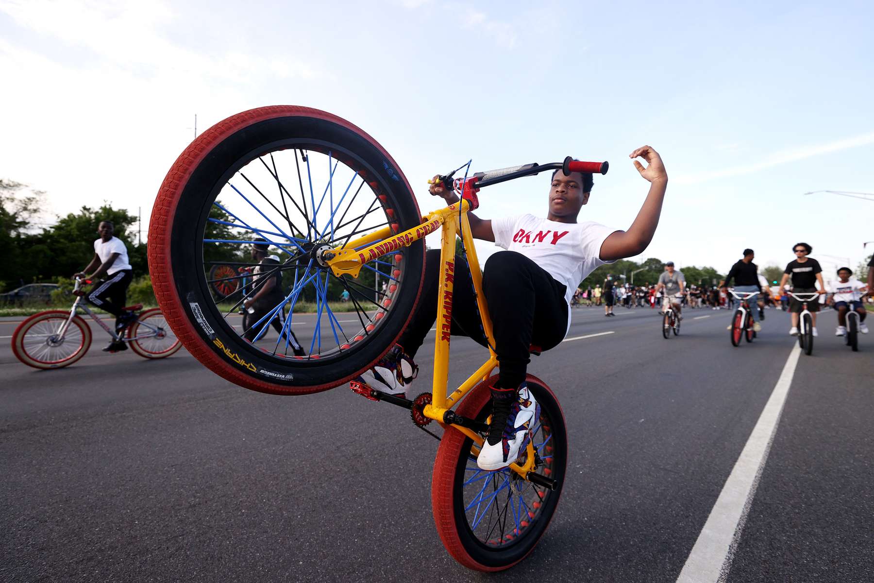 A Protester pops a wheelie on his bicycle to demonstrate the death of George Floyd on June 04, 2020 in Merrick, New York.  Minneapolis Police officer Derek Chauvin was filmed kneeling on George Floyd's neck. Floyd was later pronounced dead at a local hospital. Across the country, protests against Floyd's death have set off days and nights of rage as its the most recent in a series of deaths of black Americans by the police.  