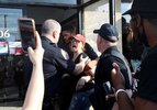 A woman is detained by Nassau County Police after disrupting the Protest for George Floyd on June 04, 2020 in Merrick, New York.  Minneapolis Police officer Derek Chauvin was filmed kneeling on George Floyd's neck. Floyd was later pronounced dead at a local hospital. Across the country, protests against Floyd's death have set off days and nights of rage as its the most recent in a series of deaths of black Americans by the police. 