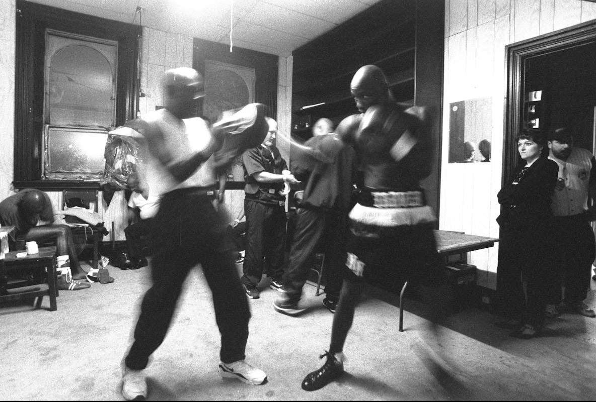 Former USA Olympian Antonio Tarver hits boxing mitts in his dressing room prior to a bout during Fight Night at the Blue Horizon on April 29, 1997 in Philadelphia, Pennsylvania