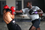 New York Golden Gloves boxer Dennis Guerrero (left) spars with recreational boxer Raheem Yusuff during training session in a warehouse that was once Jetty gym on July 30, 2020 in Oceanside, New York.  Guerrero, who is a co owner of Jetty has tried to hold many types of outdoor and open air workouts while the gym remains closed due to the coronavirus pandemic.  Since all gyms in New York had been closed since March 13, they have been trying to keep up financially to sustain the gym. Guerrero and his partner Michael Levitz have decided to closed their doors for good next week.  They will be moving their workouts online and at select locations.  Governor Andrew Cuomo announced that gyms will not be permitted to reopen during phase 4 until New York's Health Department determines if air filtering systems are circulating the coronavirus. More than 4,540,000 people in the United States alone have been infected with the coronavirus and at least 154,000 have died.  
