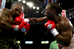 Lennox Lewis hits Mike Tyson with a right hook in the 8th round during their WBC/IBF heavyweight championship bout on June 8, 2002 at The Pyramid in Memphis, Tennessee.  