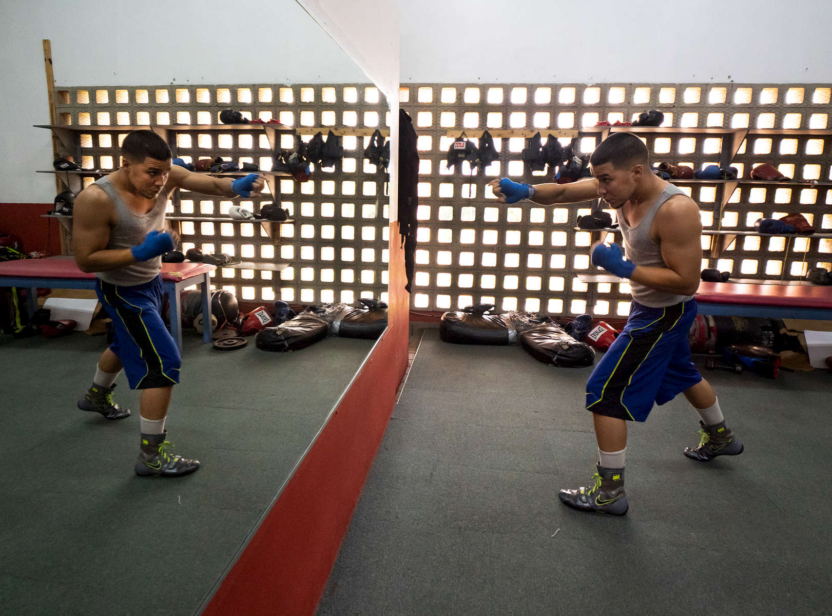 Professional Lightweight boxer Nestor Bravo with a record of 15-0 shadow boxes in front of the mirror in the boxing gym at the German Rieckehoff Sampayo Carolina Sports School on November 13, 2018 in Carolina, Puerto Rico. 