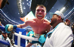 Canelo Alvarez celebrates after defeating Billy Joe Saunders who did not answer the bell for the eighth round during their fight for Alvarez's WBC and WBA super middleweight titles and Saunders' WBO super middleweight title at AT&T Stadium on May 08, 2021 in Arlington, Texas. 