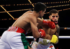 Jose Zepeda punches Josue Vargas and knocks him down with this punch in the first round during their junior welterweight fight fight at The Hulu Theater at Madison Square Garden on October 30, 2021 in New York City. 