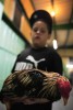 A young boy holds his Fighting Rooster as it quivers in his arms after losing it's fight and it's sight on opening night of the Cockfighting season at the Coliseo Central De Barranquitas on November 11, 2006 in Barranquitas, Puerto Rico.