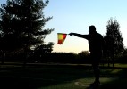 A referee signals with his flag as competitors participate in the Fedeiguayas Soccer League on November 10, 2007 at Flushing Meadows Park in Queens New York