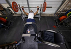 Team USA Para Powerlifter Garrison Redd bench presses with his legs strapped to the bench to secure his body in place during a training session at Gaglione Strength Gym on April 07, 2021 in Farmingdale, New York. 