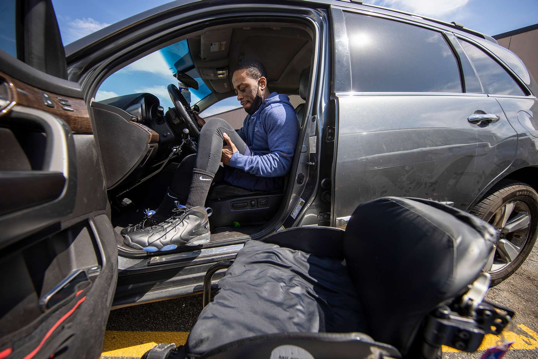 Team USA Para Powerlifter Garrison Redd lifts himself and his wheelchair into his car after training at Gaglione Strength Gym on April 07, 2021 in Farmingdale, New York.  