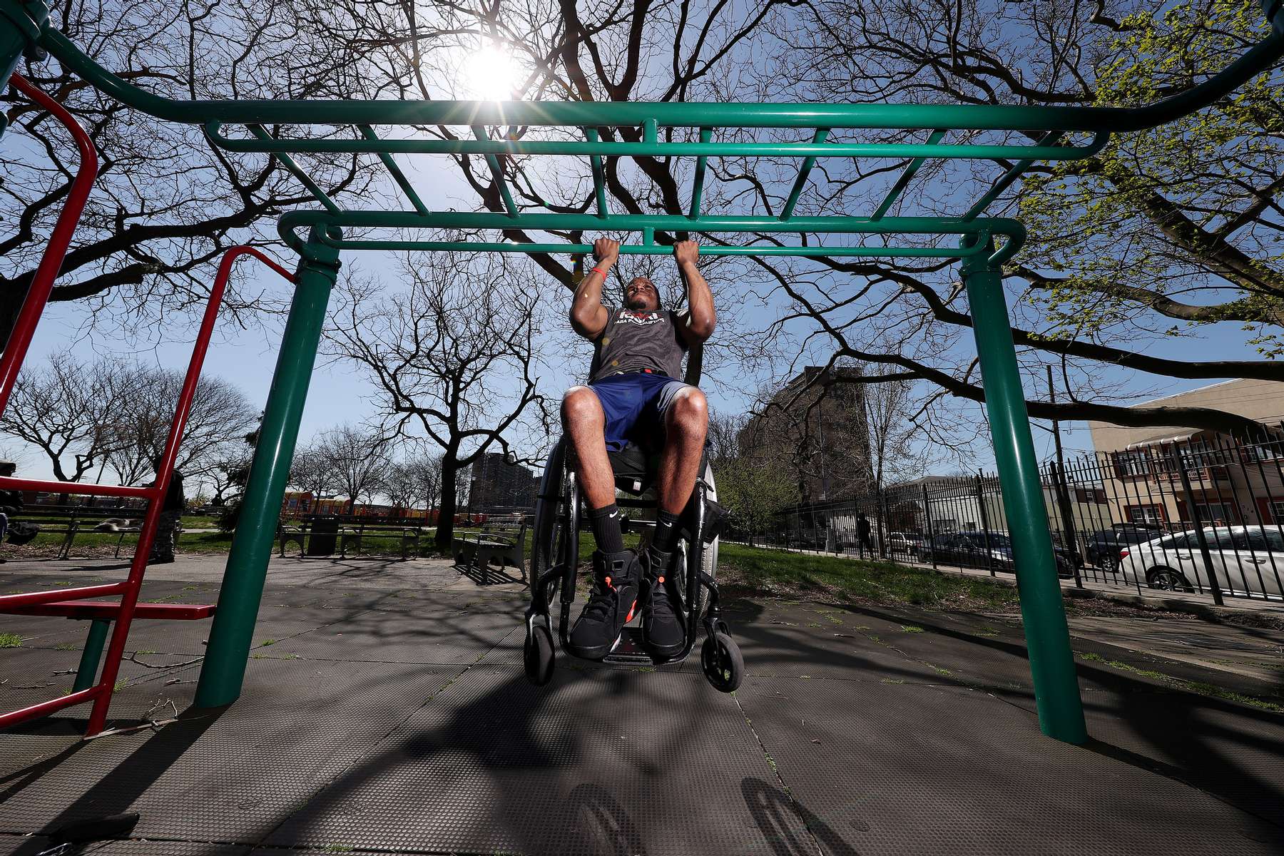 Team USA Para Powerlifter Garrison Redd trains in his wheelchair doing chin-ups in Robert E. Venable Park  on April 06, 2021 in Brooklyn, New York.   
