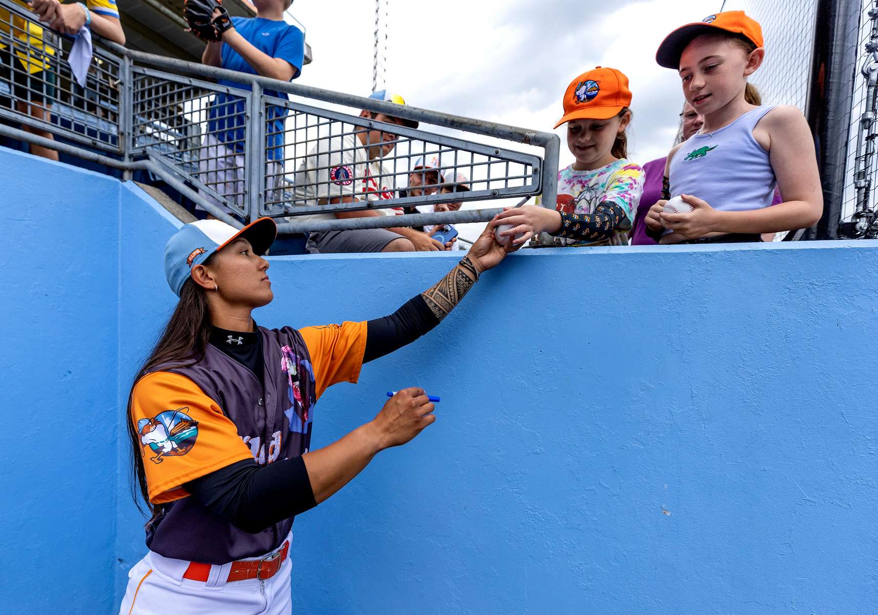 Kelsie Whitmore signs autograph before her game against the Charleston Dirty Birds at Richmond County Bank Ballpark on July 08, 2022 in Staten Island, New York.  Whitmore was the first woman to appear in the starting lineup in an Atlantic League game.  Her debut in the Atlantic League was a pinch runner on April 22, and became the first woman to start an Atlantic League game on May 1,  playing as a left fielder.  On May 4, she became the first woman to pitch in an Atlantic League game. 
