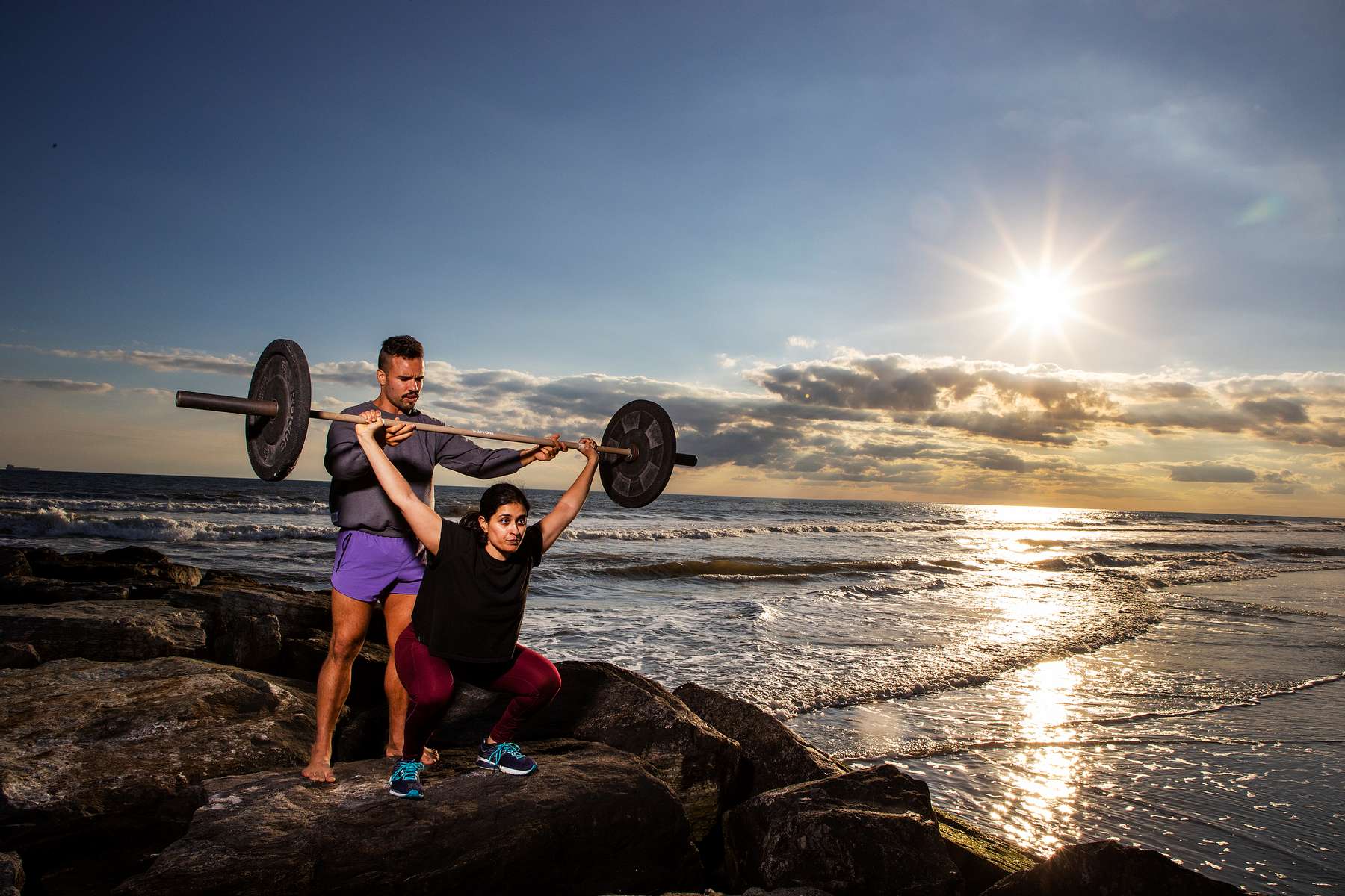 Neha Doshi trains with Fitness Instructor Dennis Guerrero during a Life Outside the Box (LOTB) workout on October 22, 2021 in Long Beach, New York.  