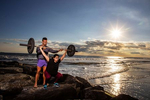 Neha Doshi trains with Fitness Instructor Dennis Guerrero during a Life Outside the Box (LOTB) workout on October 22, 2021 in Long Beach, New York.  