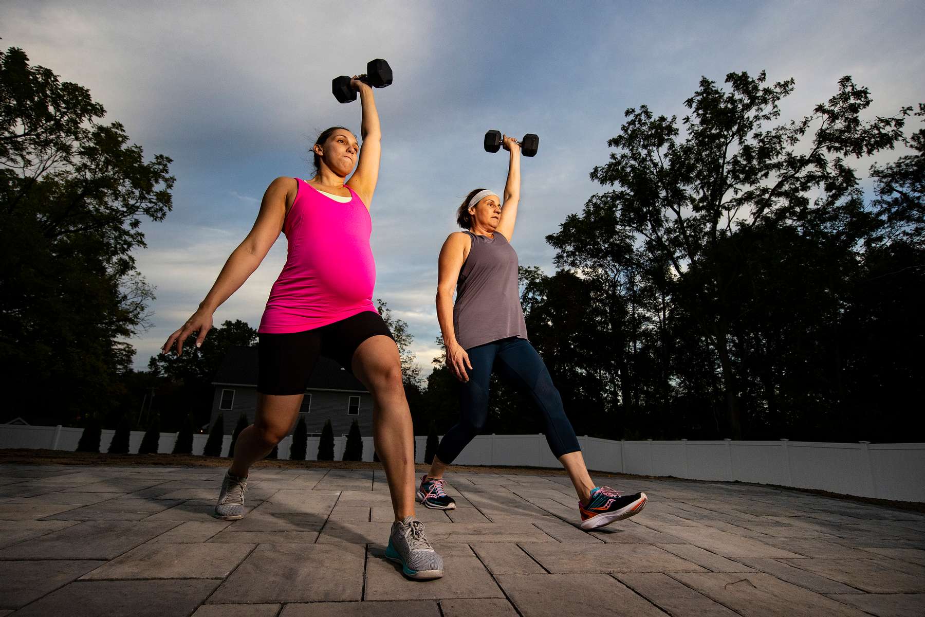 CrossFit athlete Katie Devantier Prabhu trains with her Mother Paula Devantier at her home during a Life Outside the Box (LOTB) virtual Zoom training class  on September 21, 2021 in Niskayuna, New York.  Katie is 7 1/2 months pregnant with twins and continues to train with the LOTB program.  She is due to give birth in November to a boy and girl. 