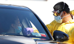 A medical professional administers a coronavirus test at a drive-thru coronavirus testing site run by  ProHealth Care on April 06, 2020 in Jericho, New York. The World Health Organization declared coronavirus (COVID-19) a global pandemic on March 11th. 