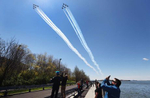 The U.S. Navy's Blue Angels and U.S. Air Force's Thunderbirds perform a flyover across Brooklyn Bridge park as a tribute to honor NYC COVID-19 frontline workers on April 28, 2020 in the Brooklyn borough of New York City.  The World Health Organization declared coronavirus (COVID-19) a global pandemic on March 11th. 