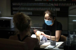 Vickie Lee does the nails of a customer at Revive Nails and Spa as Long Island begins Phase 3 of reopening, allowing restaurants To Seat Inside At 50 Percent Capacity and nail salons to open by appointment only on June 24, 2020 in Huntington, New York. 