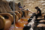 Cynthia Lee does a pedicure for a customer at Revive Nails and Spa as Long Island begins Phase 3 of reopening, allowing restaurants To Seat Inside At 50 Percent Capacity and nail salons to open by appointment only on June 24, 2020 in Huntington, New York. 