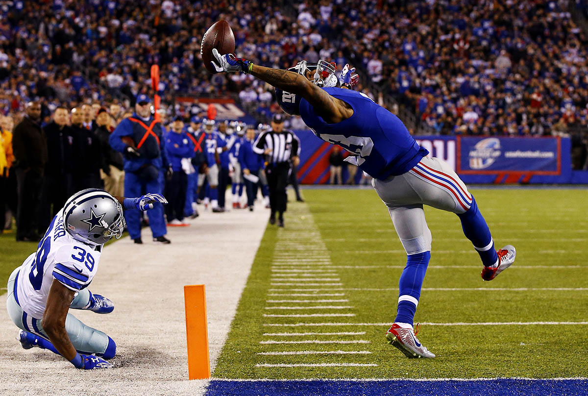 Odell Beckham #13 of the New York Giants scores a touchdown in the second quarter against the Dallas Cowboys at MetLife Stadium on November 23, 2014 in East Rutherford, New Jersey. 