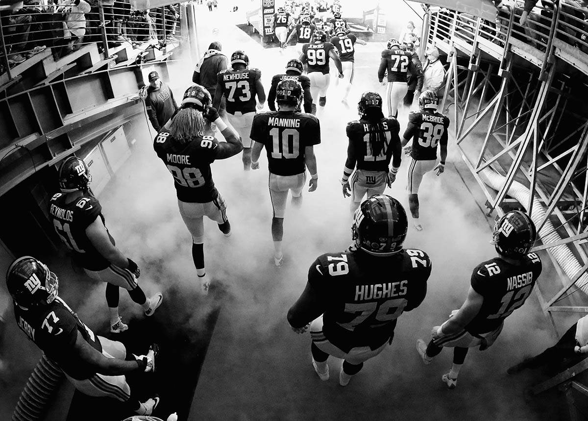 Eli Manning #10 of the New York Giants heads out of the tunnel with his team to play the New England Patriots at MetLife Stadium on November 15, 2015 in East Rutherford, New Jersey. 