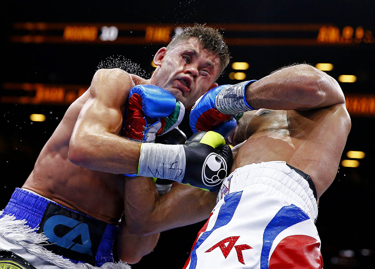 NEW YORK, NY - MAY 29:  Amir Khan punches Chris Algieri during their Welterweight bout at Barclays Center of Brooklyn on May 29, 2015 in New York City.  