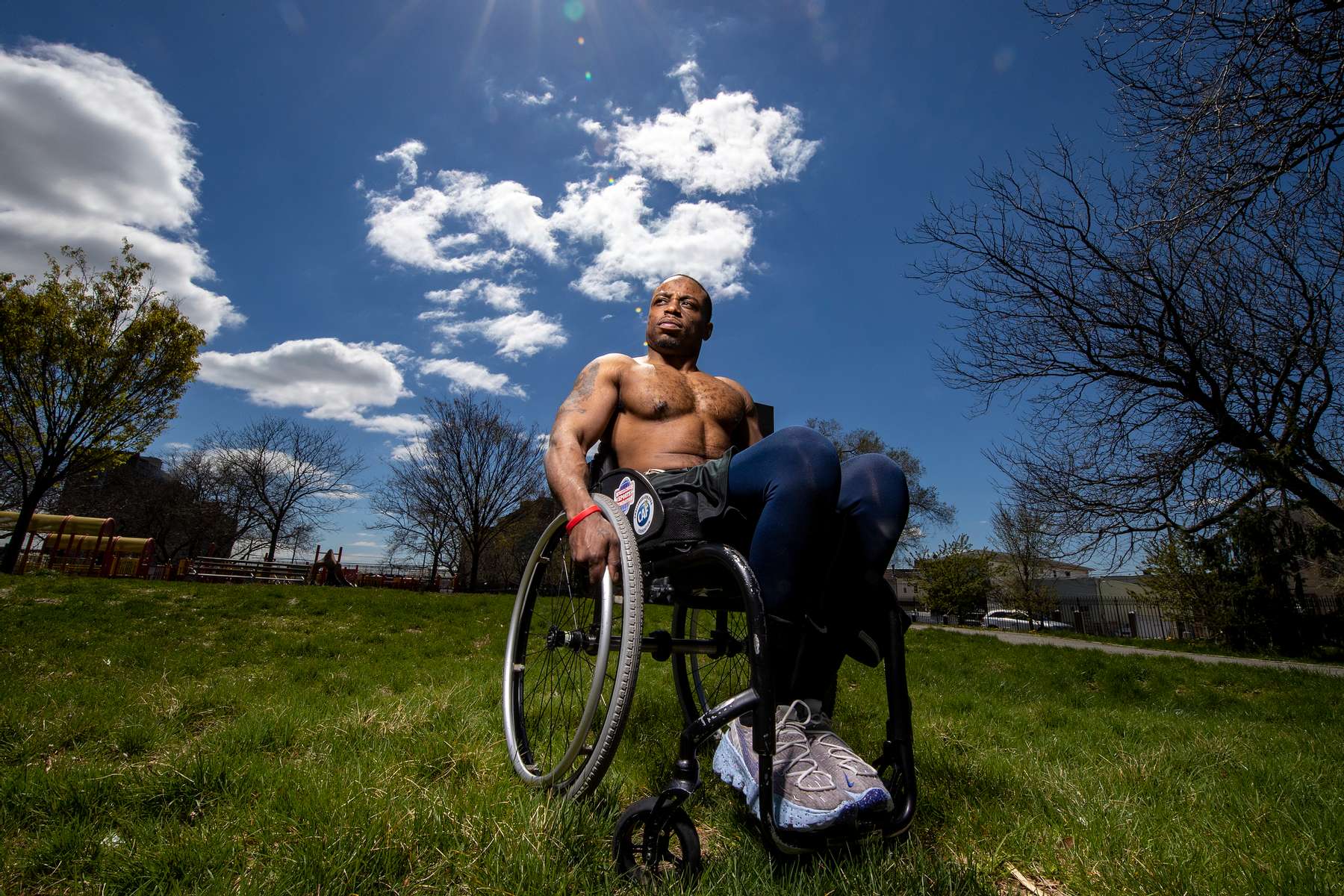 Team USA Para Powerlifter Garrison Redd poses for a portrait in his wheelchair in Robert E. Venable Park on April 13, 2021 in Brooklyn, New York. Redd was a standout high school football star running back. He also participated in boxing and baseball. In the Summer of 2005 he was the victim of a random shooting as an innocent bystander while standing on the corner of his home in Brownsville section of Brooklyn. The bullet burned the nerves surrounding the T-12 section of his spine. He has been paralyzed from the waist down ever since. He has competed in Wheelchair Racing, and Adaptive Field sports. In 2018 he turned his attention to Para Powerlifting and hopes to compete in the 2021 Tokyo Paralympic Games this summer. 