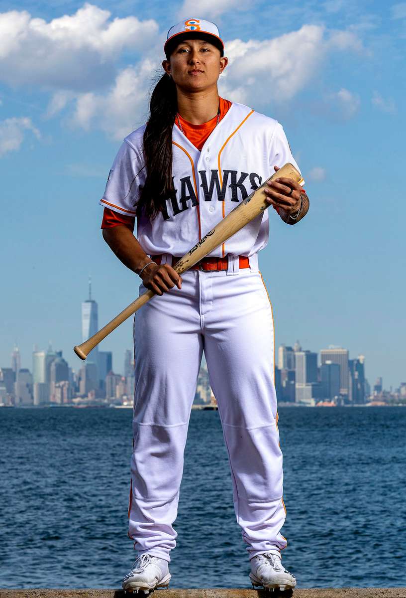 Kelsie Whitmore #3 of the Staten Island Ferryhawks poses for a photo in front of the New York Skyline on July 09, 2022 in Staten Island, New York. Whitmore is the first woman to record a hit in association with Major League Baseball.  She was the first woman to appear in the starting lineup as a left fielder, and relief pitch in an Atlantic League game. 