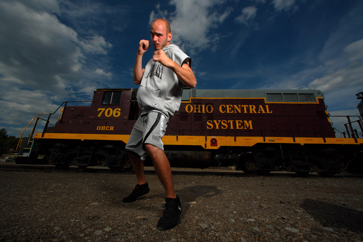 Middleweight Boxing Champion Kelly Pavlik poses in front of a Locomotive Train on July 16, 2007 in Youngstown, Ohio. 